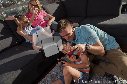 Image of Happy family playing a video game