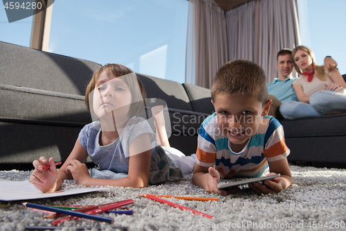 Image of young couple spending time with kids