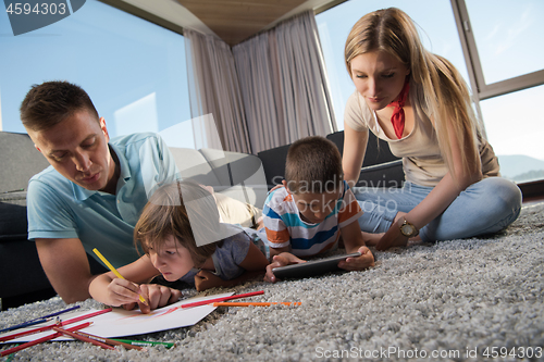 Image of young couple spending time with kids