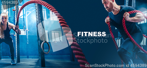 Image of Men with battle rope battle ropes exercise in the fitness gym.