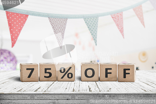 Image of Special price 75 percent off promotion sign