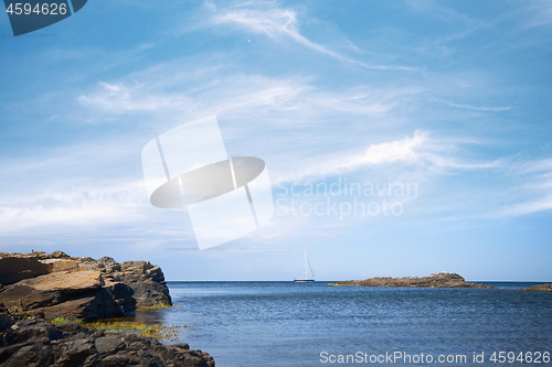 Image of Sailboat on the sea under a blue sky