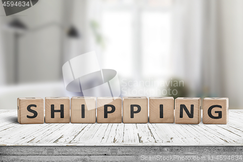 Image of Shipping sign on a wooden desk