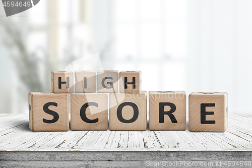 Image of High score sign on a table in a bright home