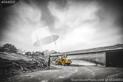 Image of Yellow excavator at a construction site