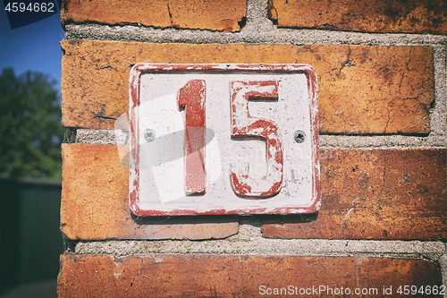 Image of Street number 15 on a sign