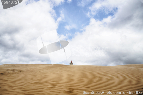 Image of Lighthouse buried in a large sand dune