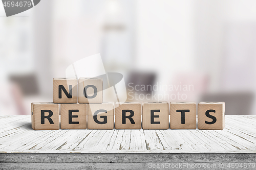 Image of No regrets sign made with wooden blocks