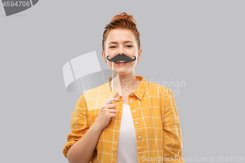 Image of red haired teenage girl with black moustaches