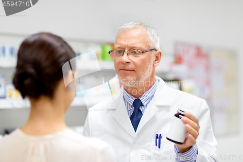 Image of apothecary and woman with drug at pharmacy