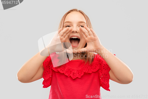 Image of beautiful girl calling for someone or shouting