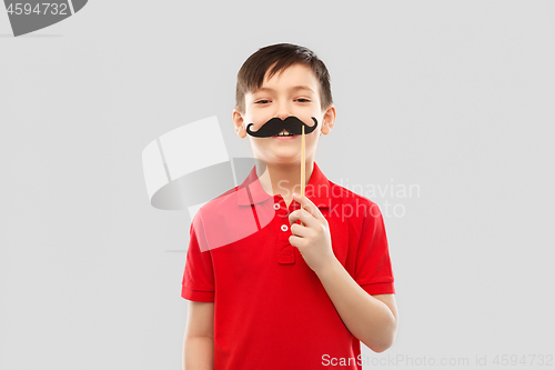 Image of smiling boy in red t-shirt with black moustaches