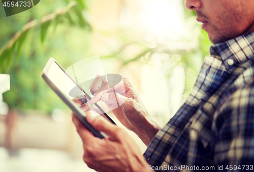 Image of close up of man with tablet pc