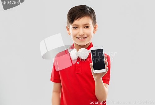 Image of boy with headphones showing smartphone