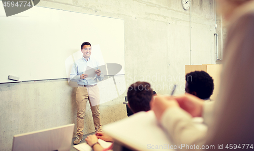 Image of group of students and teacher at lecture