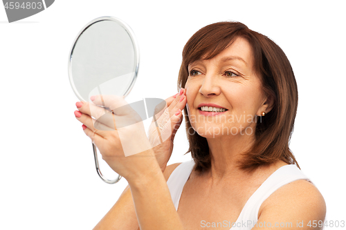 Image of portrait of smiling senior woman with mirror