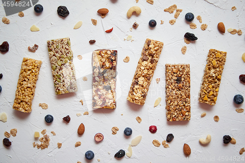 Image of Homemade gluten free granola bars with mixed nuts, seeds, dried fruits