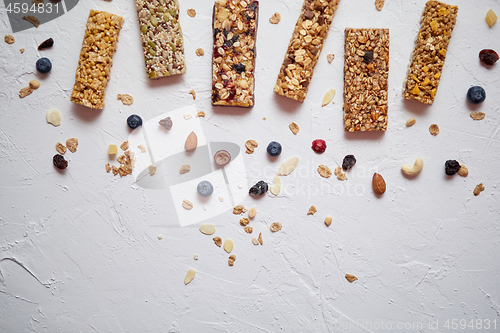 Image of Homemade gluten free granola bars with mixed nuts, seeds, dried fruits