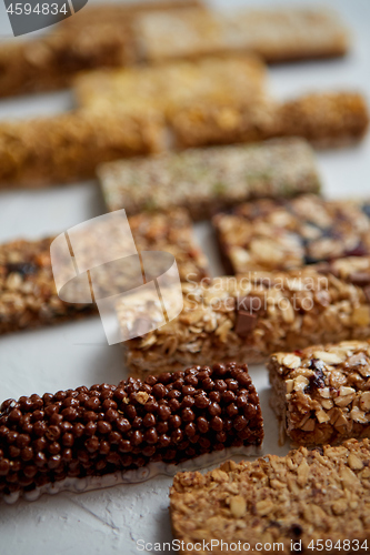 Image of Homemade gluten free granola bars with mixed nuts, seeds, dried fruits