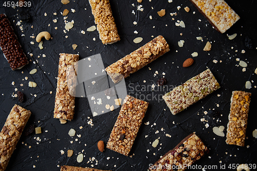 Image of Mixed gluten free granola cereal energy bars. With dried fruits and nuts