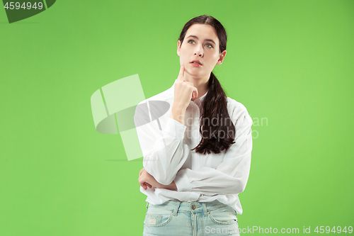 Image of Young serious thoughtful business woman. Doubt concept.