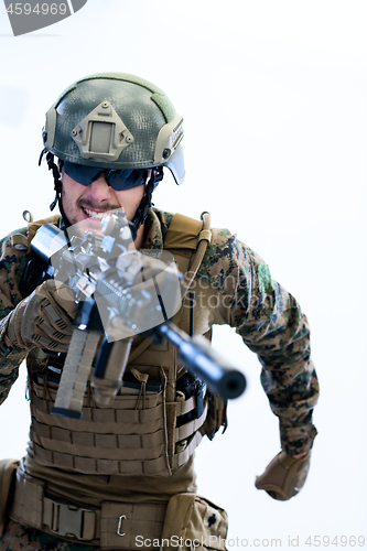 Image of soldier in action aiming laseer sight optics