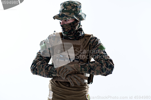 Image of soldier preparing gear for action