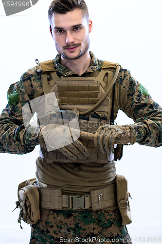 Image of closeup of soldier hands putting protective battle gloves