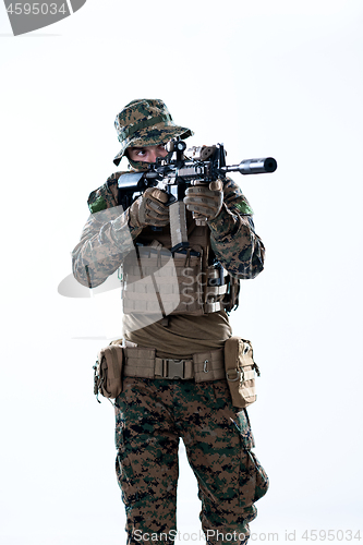 Image of soldier in action aiming laseer sight optics