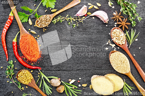 Image of Frame of spices and herbs on black board top