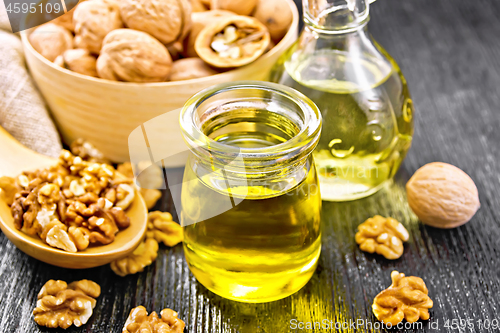 Image of Oil walnut in jar and decanter on board