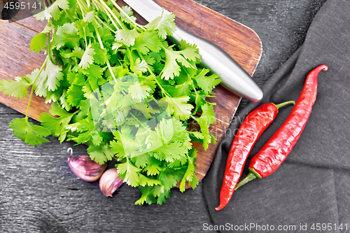 Image of Cilantro fresh with garlic on board top