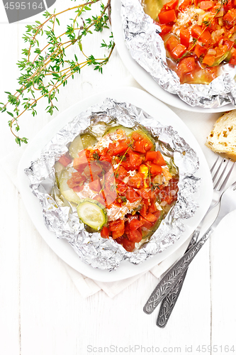 Image of Salmon with vegetables in plate on light board top