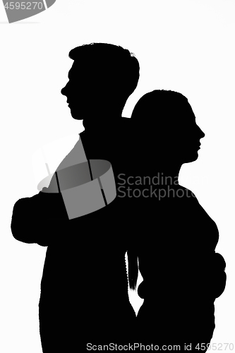 Image of Dark silhouettes of a young couple on a white background