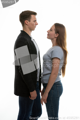 Image of a young man and a girl stand opposite each other