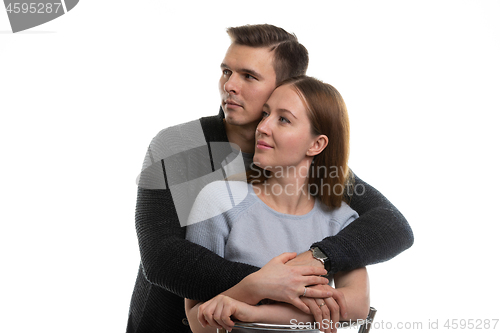 Image of Portrait of a young couple looking to the left, a white background