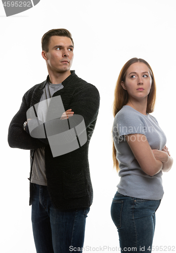 Image of Woman and a man in a grudge look past each other