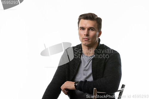 Image of Portrait of a young man in ordinary clothes, white background