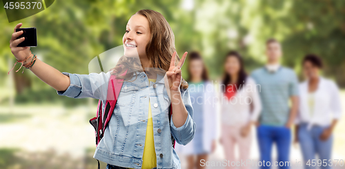 Image of teenage student girl taking selfie by smartphone