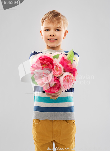 Image of smiling boy with bunch of peony flowers