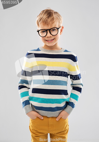 Image of smiling boy in glasses and striped pullover