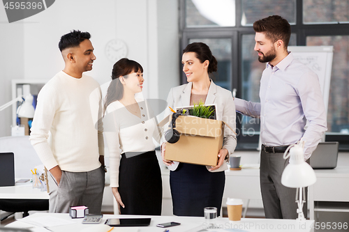 Image of new female employee with colleagues at office