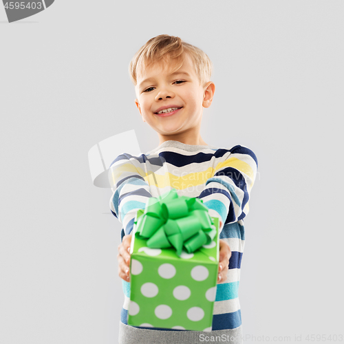 Image of smiling boy with birthday gift box