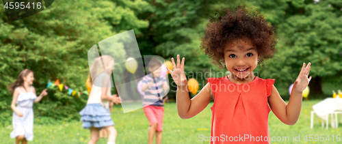 Image of happy african american girl at birhtday party