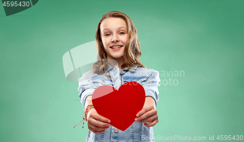 Image of girl with red heart over green school chalk board