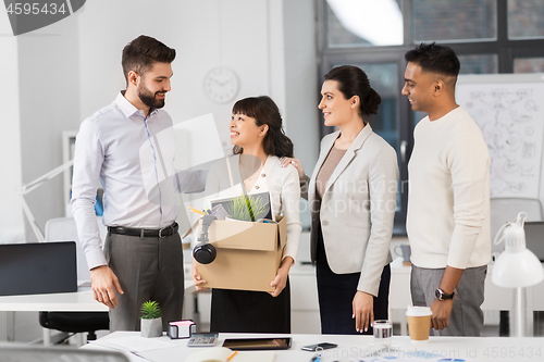 Image of new female employee with colleagues at office