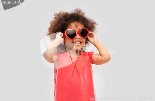 Image of african ameican girl in heart shaped sunglasses