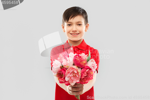 Image of smiling boy with peony flowers