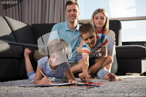 Image of young couple spending time with kids