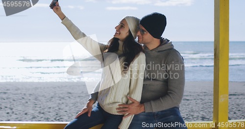 Image of Gorgeous couple taking picture of herselfe